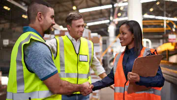 Workers shaking hands