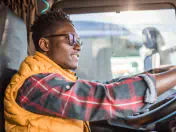 Truck driver holds steering wheel