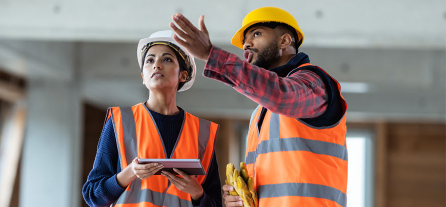 Construction workers reviewing work