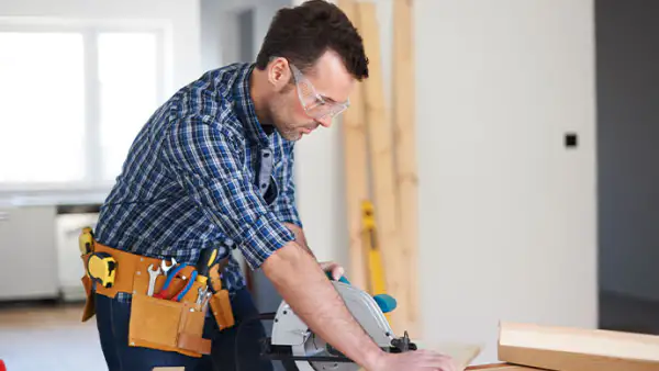 Contractor uses a saw